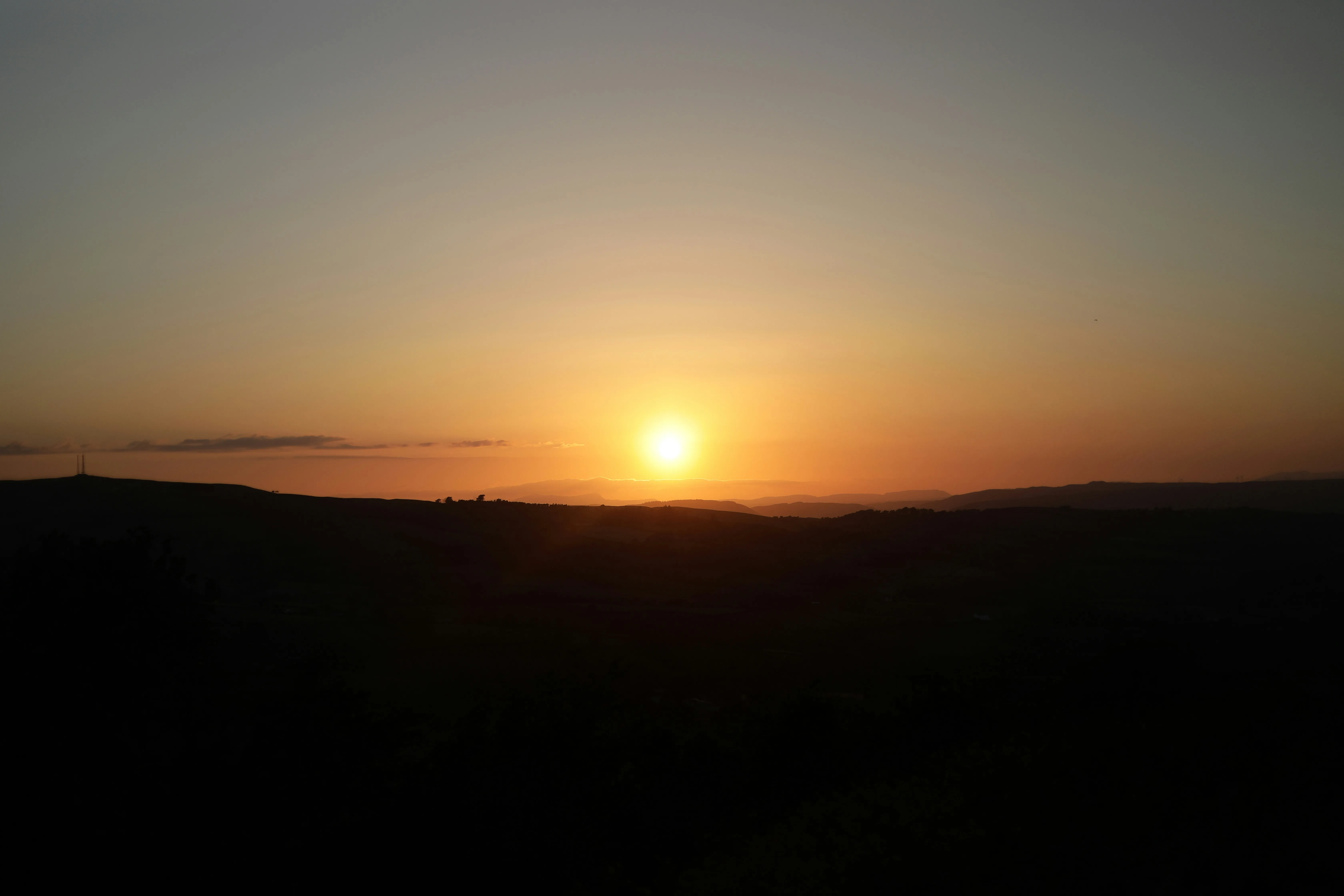 Sunrise over UK residential rooftops